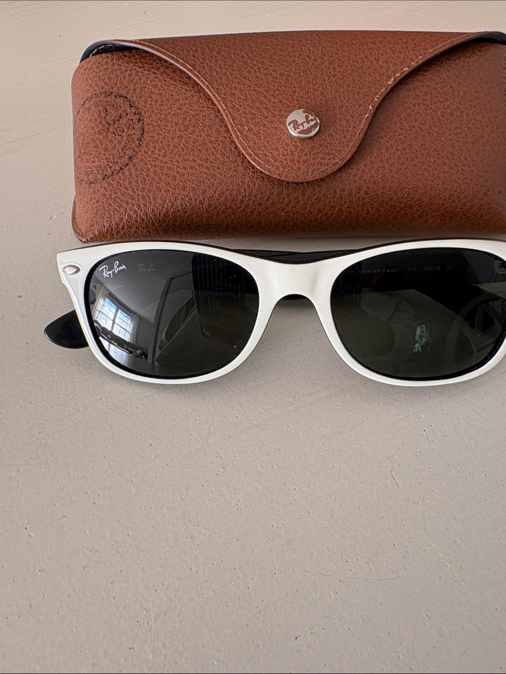 Ray-Ban Woman’s White Frame Sunglasses with Black Lenses